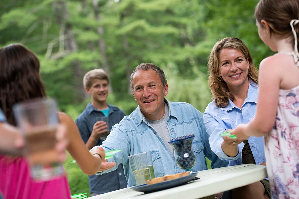 family eating together outdoors