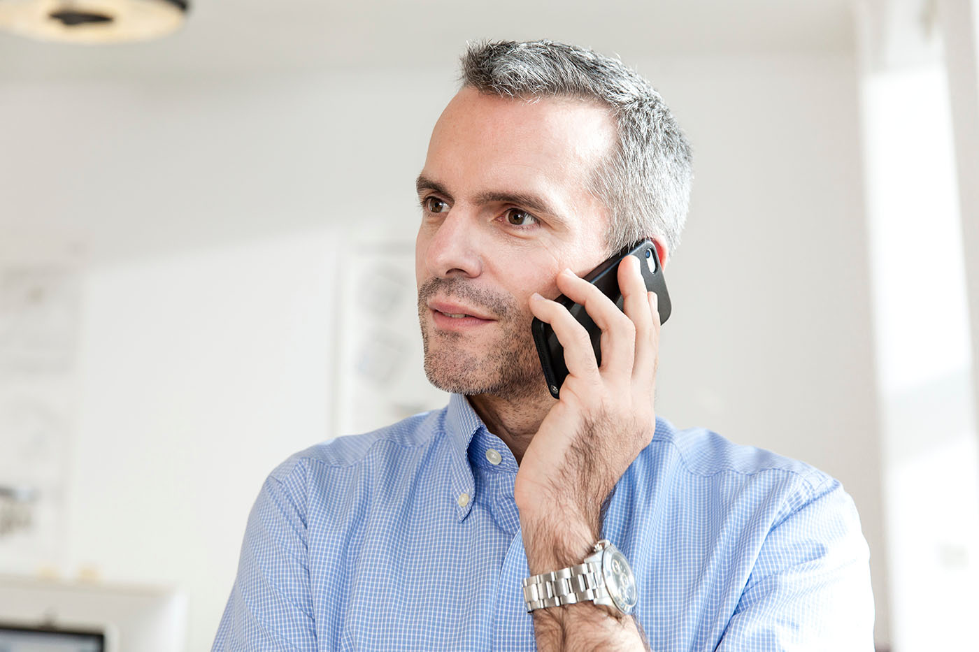 man making an appointment on his phone