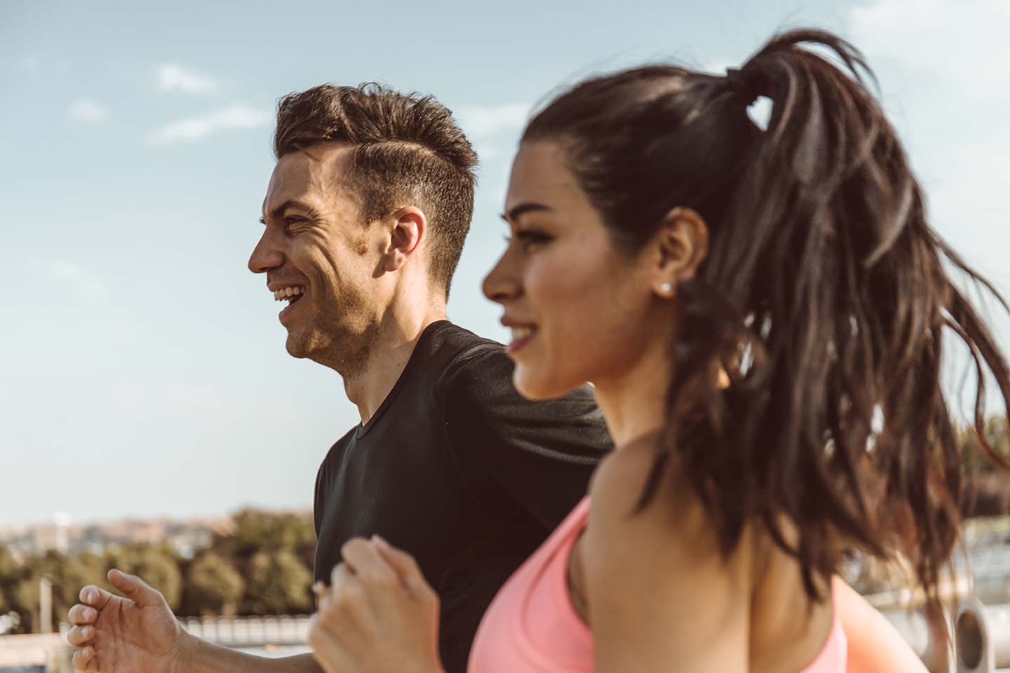 fit couple enjoys a run on a summer day