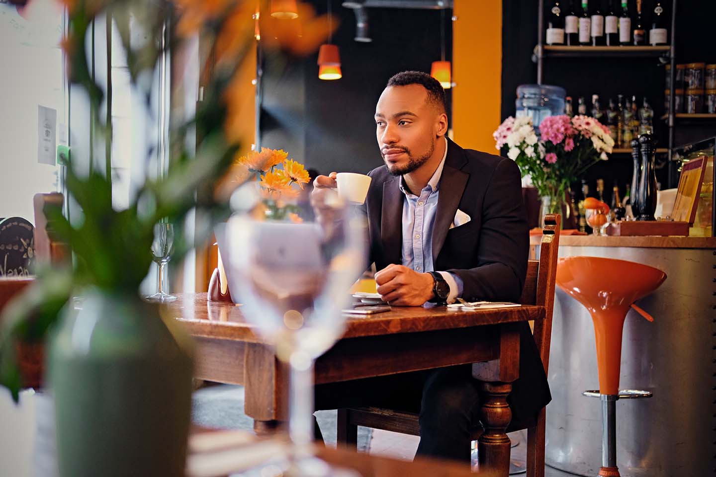 successful businessman drinks coffee at a restaurant