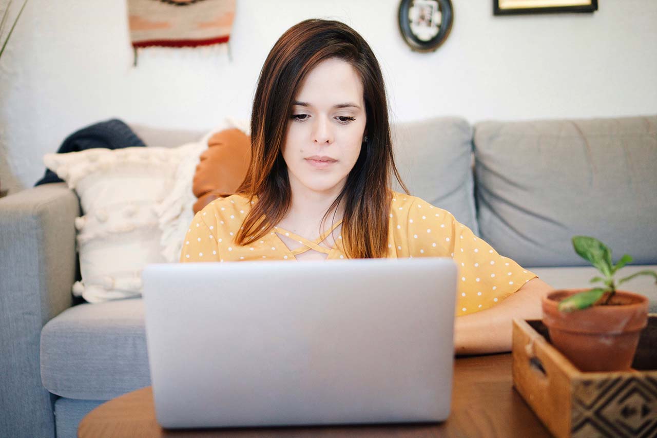 Talk with us about MNsure and OneShare individual and family plans woman researching health care plan options on her laptop